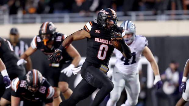 Oklahoma State's Ollie Gordon II (0) runs the ball in the first half of the college football game between the Oklahoma State University Cowboys and the Kansas State Wildcats at Boone Pickens Stadium in Stillwater. Okla., Friday, Oct. 6, 2023. OSU won 29-21.